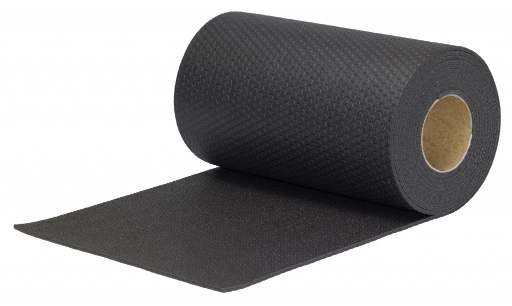 Rolled black rubber mat in white background