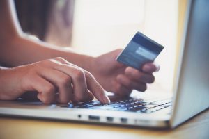 Hand holding credit card online shopping
