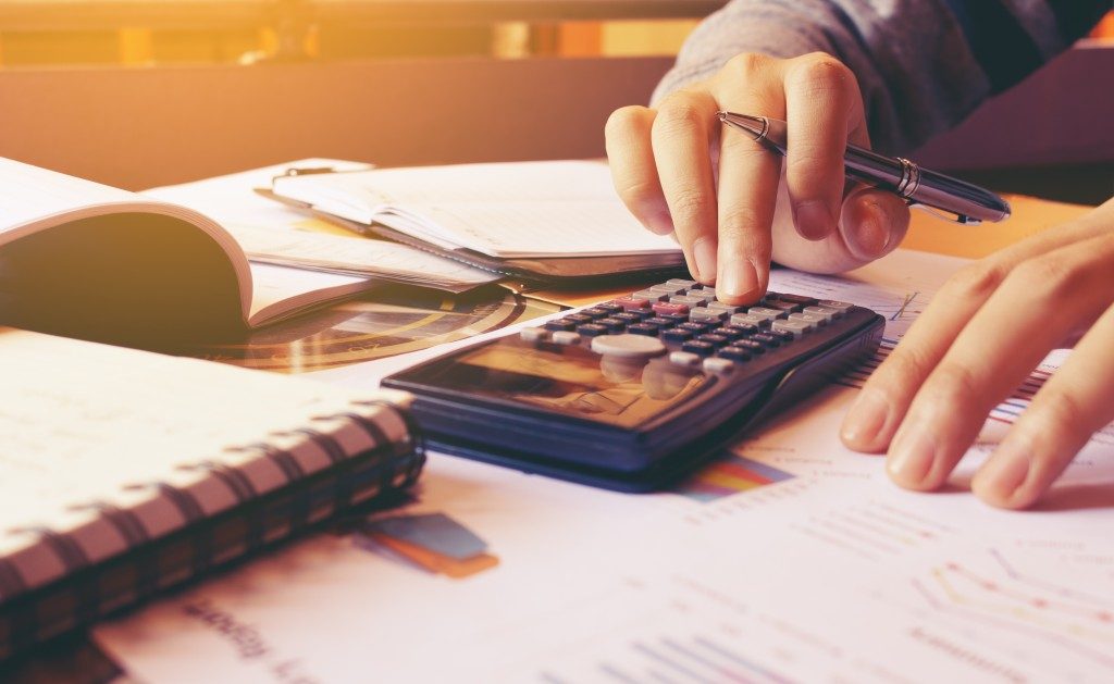Bookkeeper calculating finances