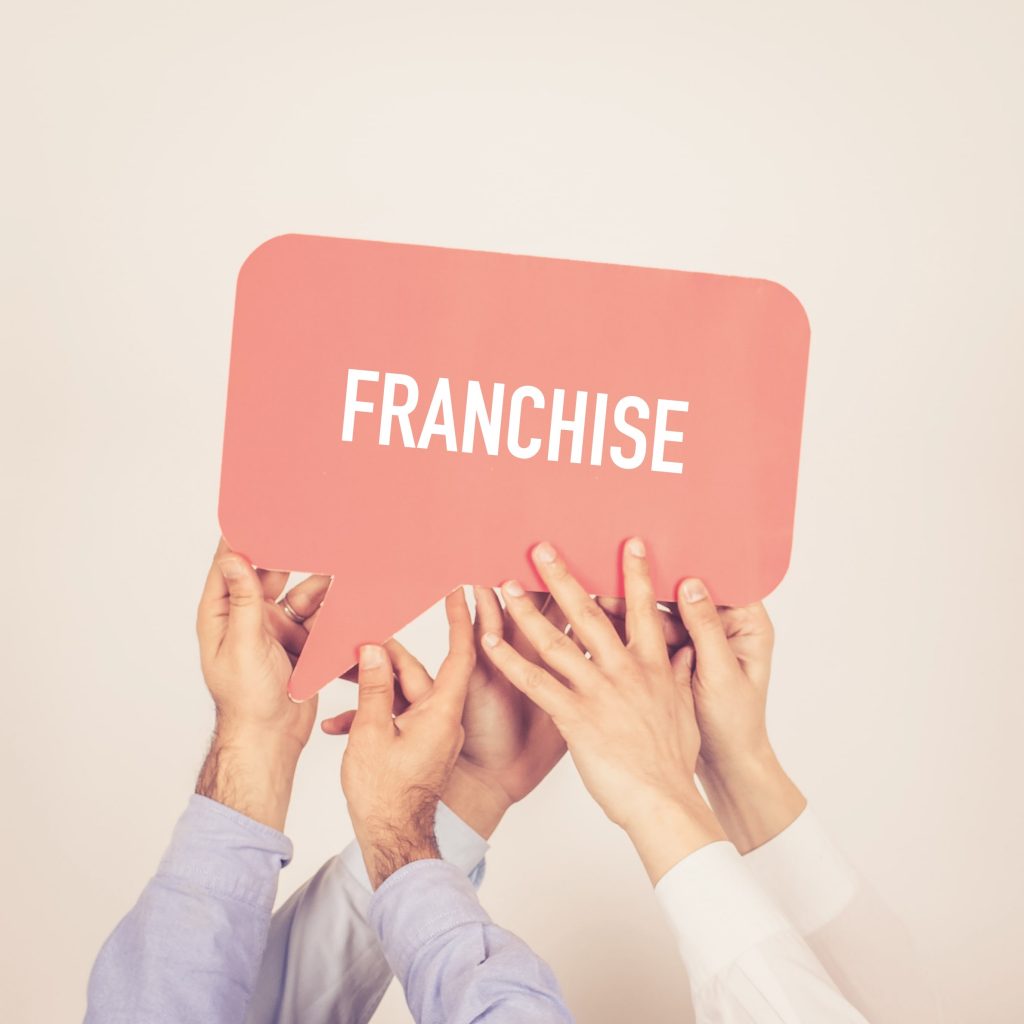 people holding a franchise message bubble