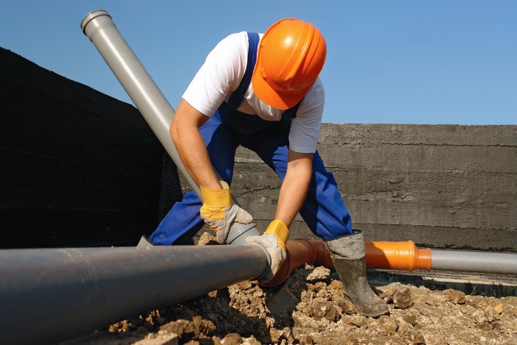 sewage pipes being maintained