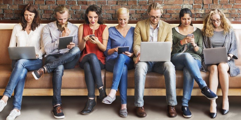 Group of people with their gadgets