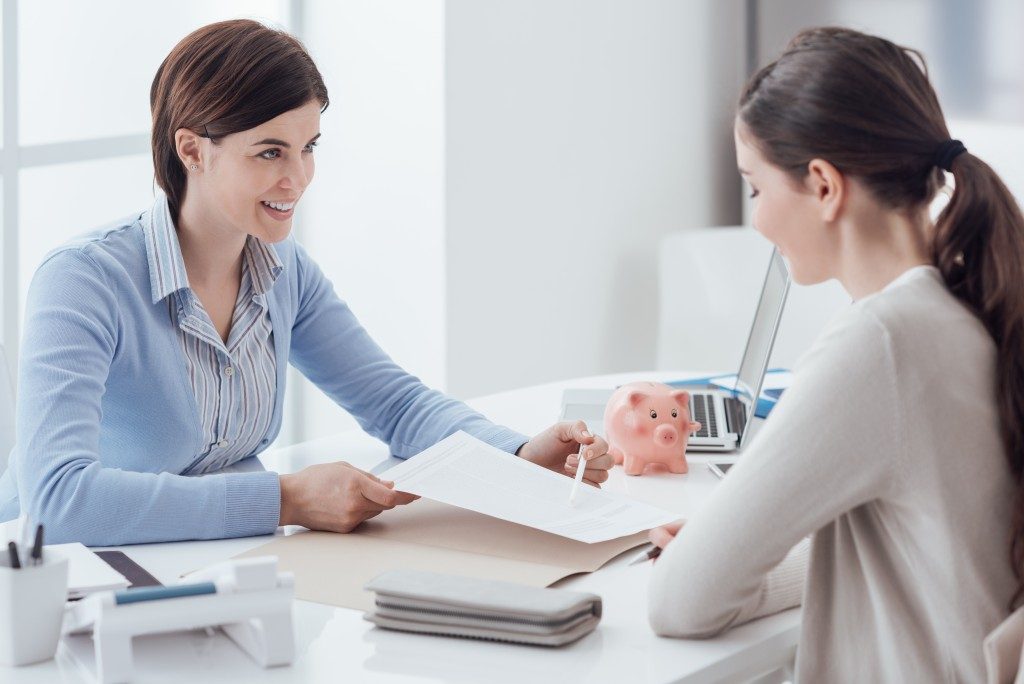 Financial advisor talking to her client