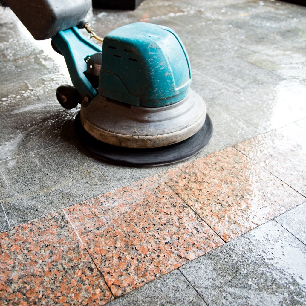 industrial scrubber being used in cleaning the floor
