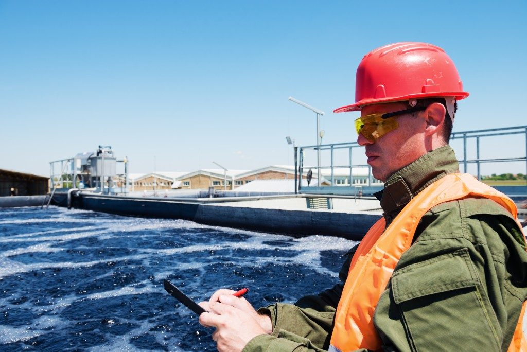 man monitoring the wastewater treatment facility